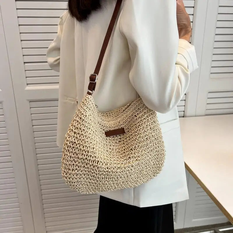 "Get ready for summer with this stylish straw crossbody bag! Perfect for beach days, holiday travels, and shopping sprees. #Fashion #SummerStyle"