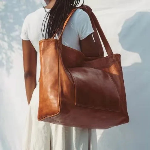 "Upgrade your everyday style with this chic Oil Wax Leather Tote Bag! Perfect for work or daily errands. #Fashion #ToteBag #Leather"