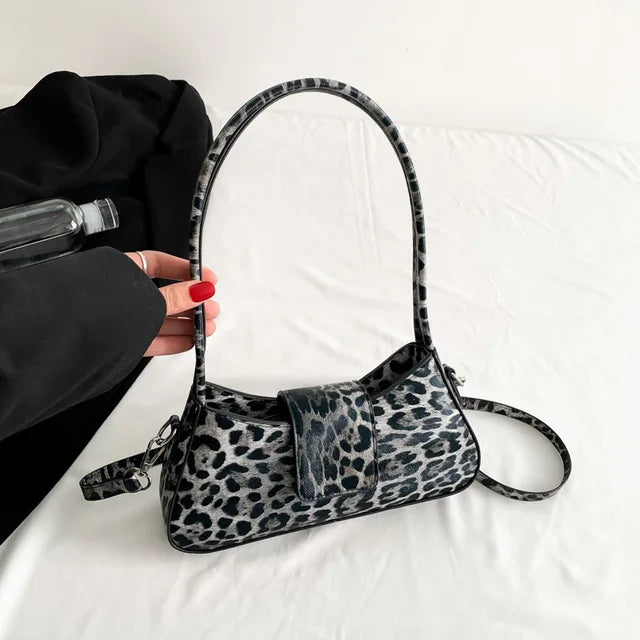 "👜 Step out in style with this chic French Underarm Bag! Perfect for all occasions 💃 #FashionForward #LeopardPrint"