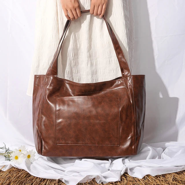 "Upgrade your everyday style with this chic Oil Wax Leather Tote Bag! Perfect for work or daily errands. #Fashion #ToteBag #Leather"