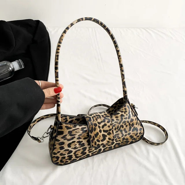 "👜 Step out in style with this chic French Underarm Bag! Perfect for all occasions 💃 #FashionForward #LeopardPrint"