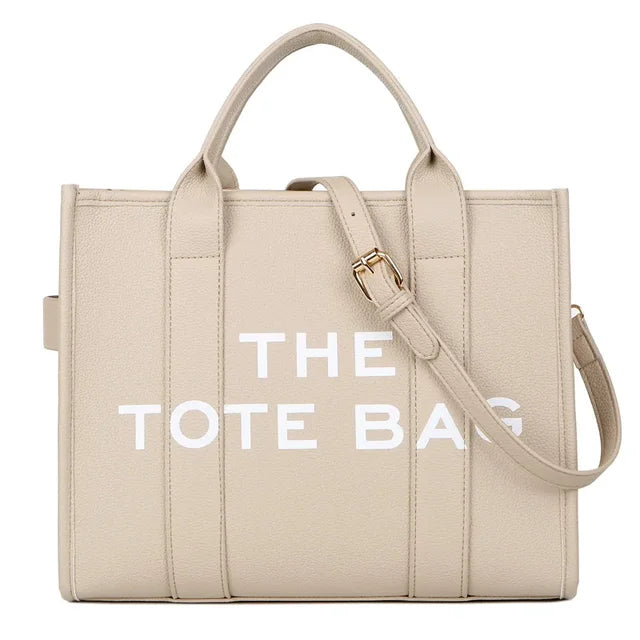 Upgrade your style with this chic solid color leather tote bag! Perfect for all your outdoor leisure activities. #Fashion #ToteBag #LeatherBag