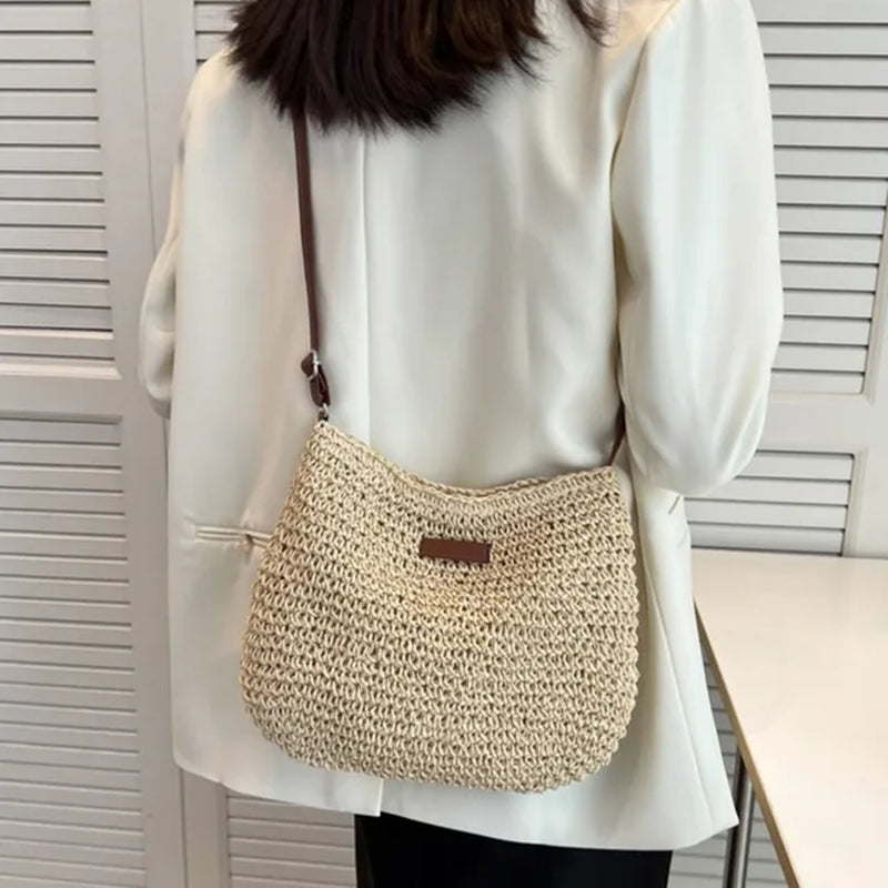 "Get ready for summer with this stylish straw crossbody bag! Perfect for beach days, holiday travels, and shopping sprees. #Fashion #SummerStyle"